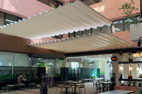 Retractable shade over courtyard at university